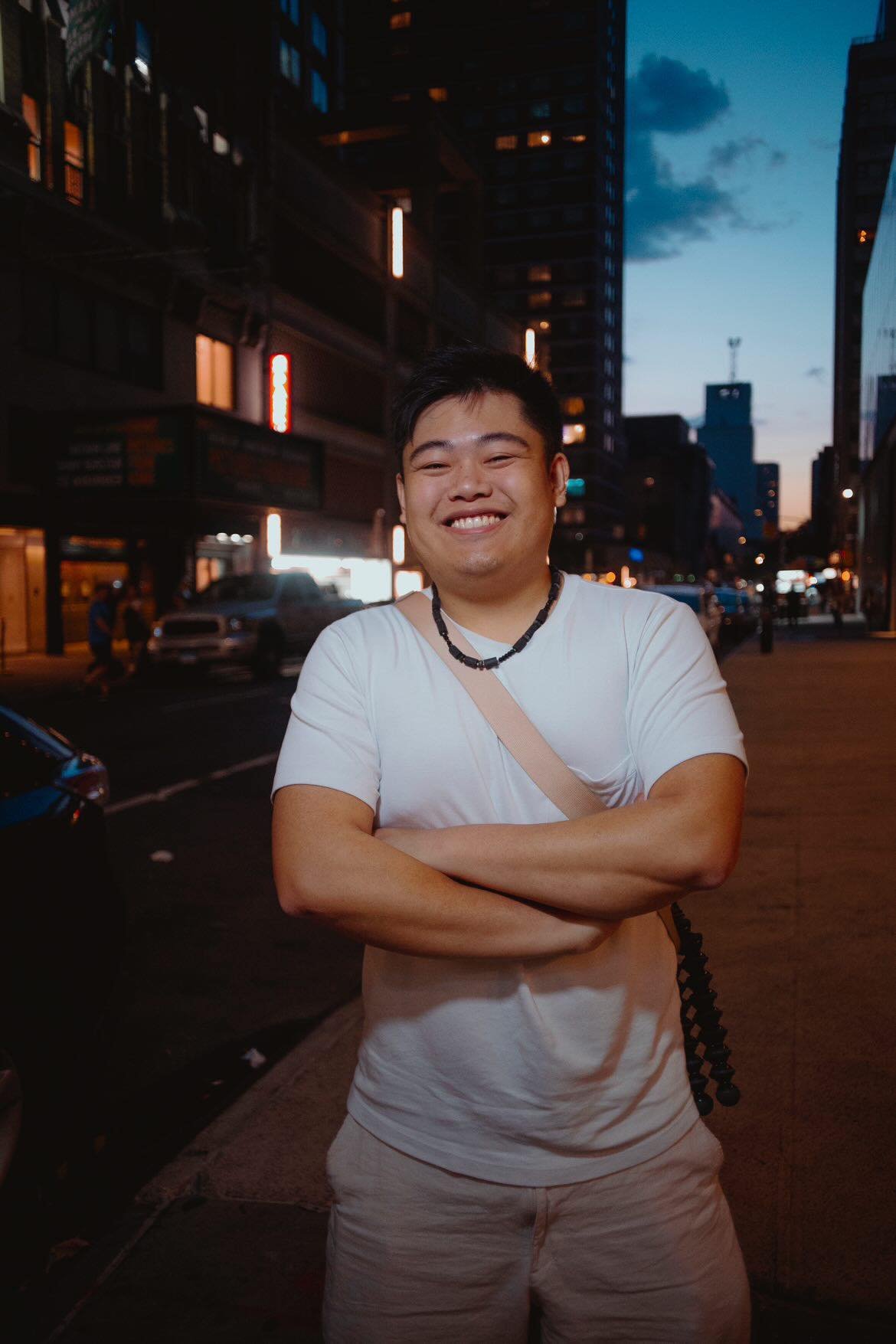 David Jin smiling on a New York City street